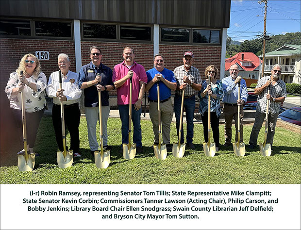 Groundbreaking group with shovels